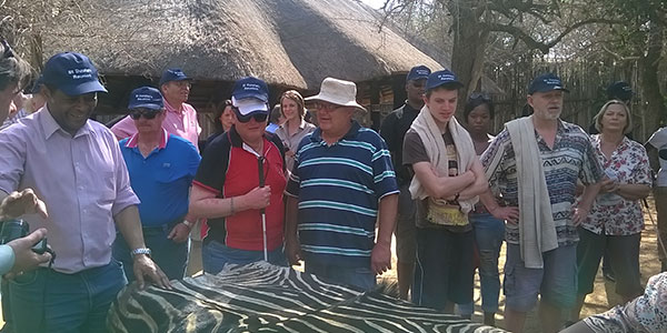 The group exploring a dried zebra skin