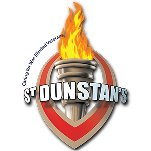 A vertical eye and a flaming torch inserted in it with words 'Saint Dunstan's' written across.